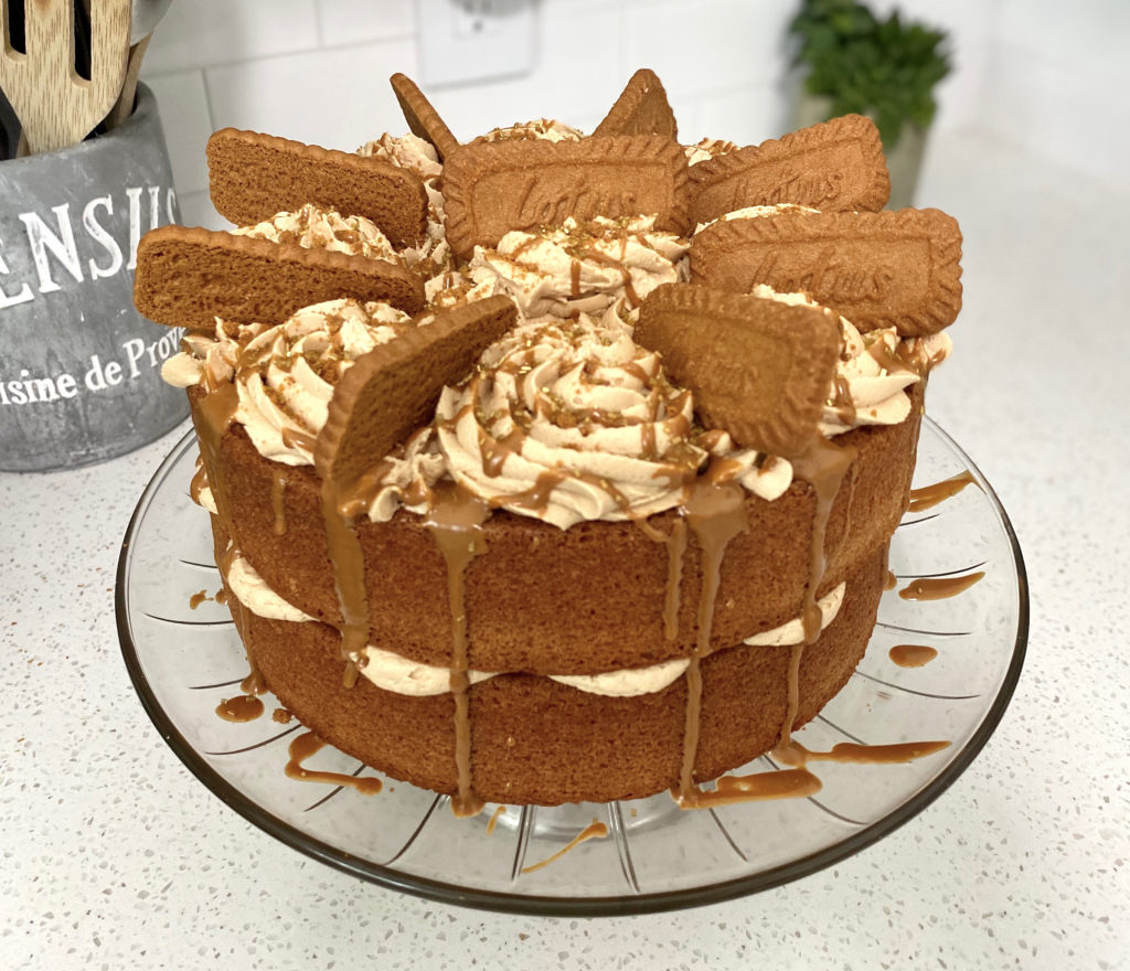 biscoff cake with biscoff buttercream, decorated with biscoff cookies on top. [biscoff cake]